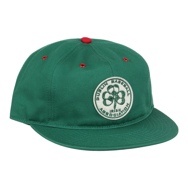 The EFF Dublin Irish Cotton Twill Ballcap is a green hat with red eyelets and a red top button, featuring a circular four-leaf clover patch and Dublin Baseball Irish Association on the front for classic Irish style.