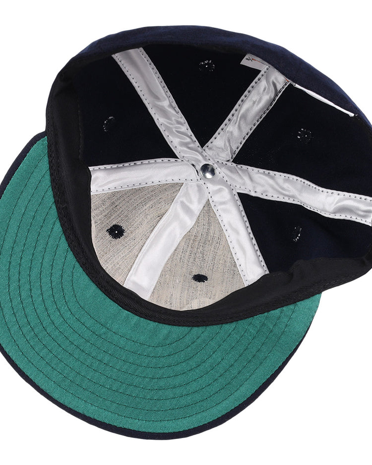 The EFF Tulsa Oilers 1969 Vintage Ballcap features a green underbrim, silver lining, stitched panels, and ventilation holes reminiscent of the classic Pacific Coast League style.