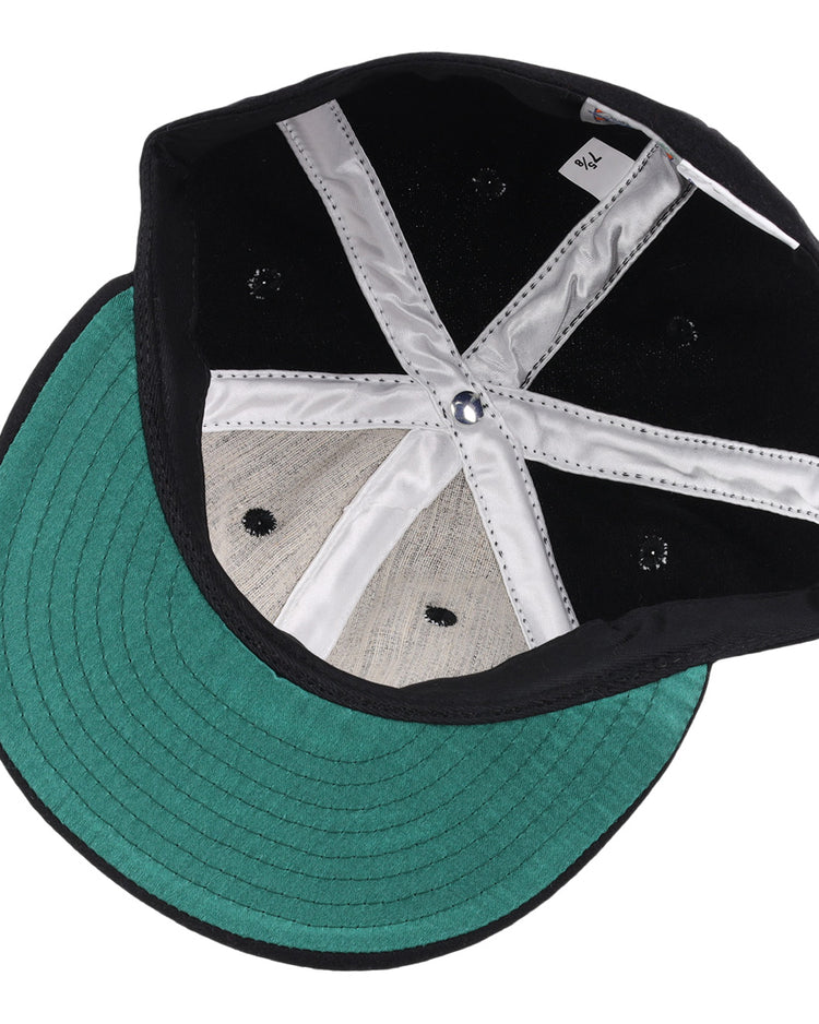The image displays the inside of the Jackson Generals 1953 Vintage Ballcap by EFF, featuring a green visor, stitched panels, and a satin-lined sweatband.