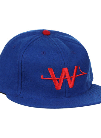 The EFF Wichita Aeros 1972 Vintage Ballcap is a blue cap with a red button and an embroidered red “W” logo on the front, authentically reproducing the classic style.