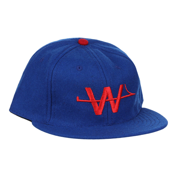 The EFF Wichita Aeros 1972 Vintage Ballcap is a blue cap with a red button and an embroidered red “W” logo on the front, authentically reproducing the classic style.