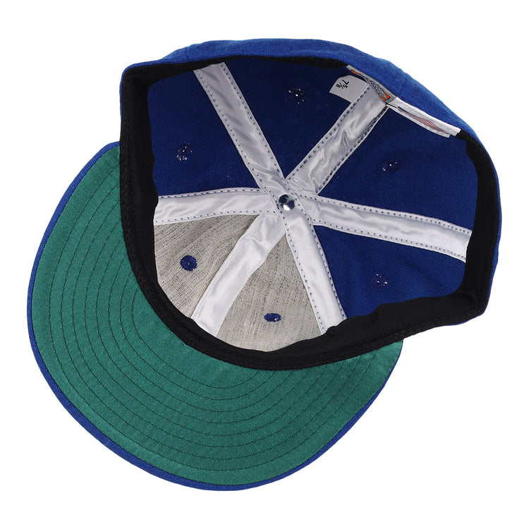 The image shows the inside of an EFF Wichita Aeros 1972 Vintage Ballcap with a green brim, white stitched panels, and a gray sweatband, highlighting its classic authentic reproduction style.