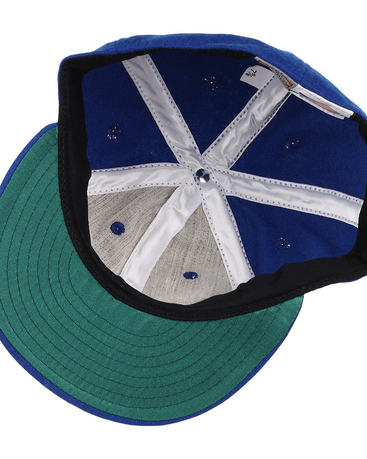 The image shows the inside of an EFF Wichita Aeros 1972 Vintage Ballcap with a green brim, white stitched panels, and a gray sweatband, highlighting its classic authentic reproduction style.