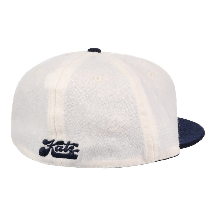 The EFF Kansas City Katz Off White Vintage Inspired Ballcap features a white crown, dark blue brim, and Katz in dark blue script on the back, modeled after the classic ballcap and shown against a plain white background.