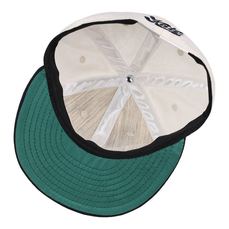 An inside view of the Kansas City Katz Off White Vintage Inspired Ballcap by EFF shows its green underbill, black trim, visible inner stitching and panels, plus a partially visible front logo reminiscent of classic Ban Johnson League style.