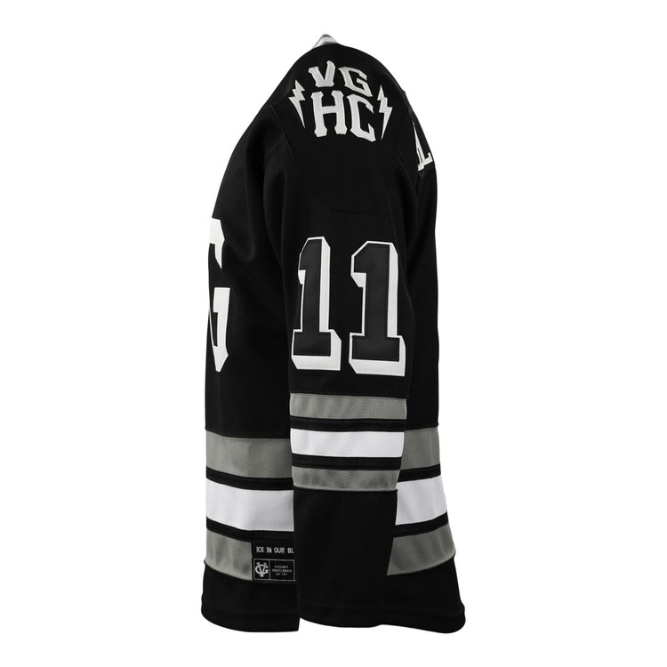 A black EFF Violent Gentlemen x EFF Collection Hockey Jersey with white and gray sleeve and waist stripes, white number 11 on the back, and VG HC near the collar, shown in side view on a mannequin.
