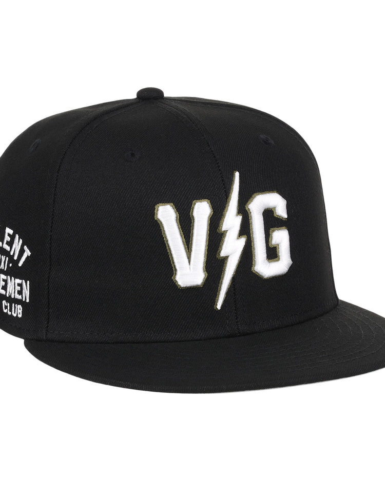 The EFF Violent Gentlemen x EFF Collection Fitted Ballcap is black with bold white VG letters split by a lightning bolt on the front and Violent Gentlemen Hockey Club on the side, part of the exclusive hockey apparel collection.
