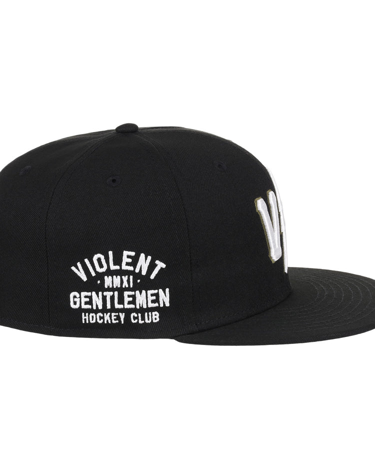 The EFF Violent Gentlemen x EFF Collection Fitted Ballcap features white embroidered Violent Gentlemen MMXI Hockey Club text on the side—a standout piece of hockey apparel for any fan.
