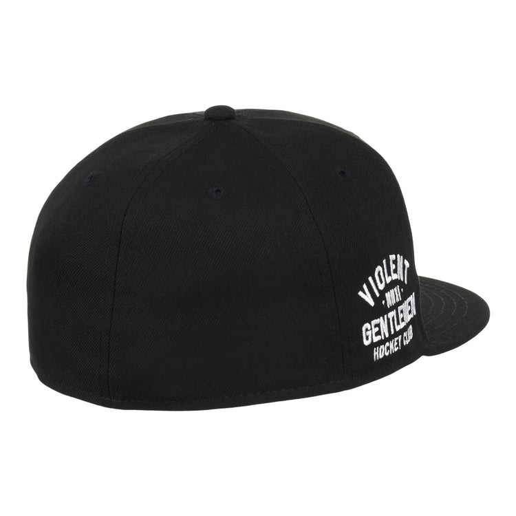The Violent Gentlemen x EFF Collection Fitted Ballcap by EFF is a black, flat-brim fitted hat featuring white VIOLENT GENTLEMEN HOCKEY CLUB embroidery on the front, viewed from the back and side. Part of the hockey apparel collection.