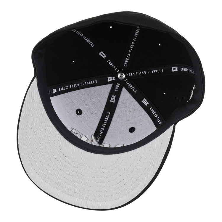 A black and white fitted ballcap from the Violent Gentlemen x EFF Collection, featuring stitched branding on the inner bands and ventilation holes on the crown—a classic hockey-inspired piece by EFF.