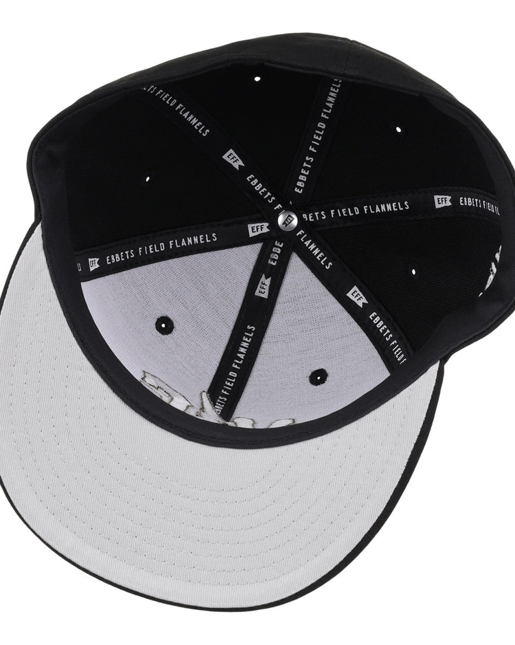 A black and white fitted ballcap from the Violent Gentlemen x EFF Collection, featuring stitched branding on the inner bands and ventilation holes on the crown—a classic hockey-inspired piece by EFF.