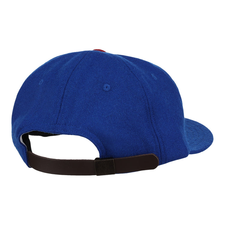 The image shows the back of the EFF Tacoma Cubs 1969 Vintage Ballcap in blue, featuring a curved brim and an adjustable black strap, inspired by classic Pacific Coast League style.