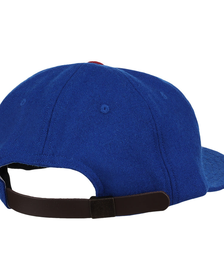 The image shows the back of the EFF Tacoma Cubs 1969 Vintage Ballcap in blue, featuring a curved brim and an adjustable black strap, inspired by classic Pacific Coast League style.