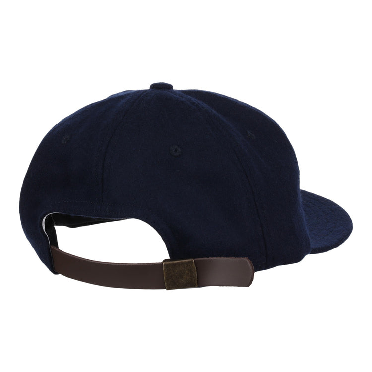 The EFF Twin Falls Cowboys 1947 Vintage Ballcap is a navy blue wool cap with a dark brown adjustable strap and metal clasp, shown from the back.