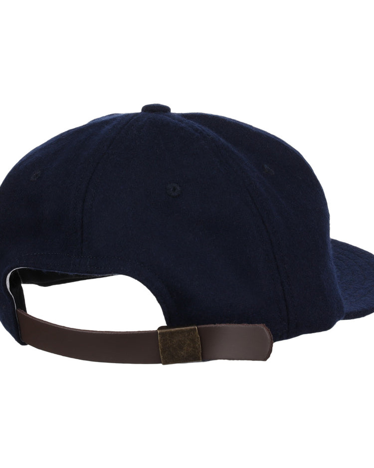 The EFF Twin Falls Cowboys 1947 Vintage Ballcap is a navy blue wool cap with a dark brown adjustable strap and metal clasp, shown from the back.