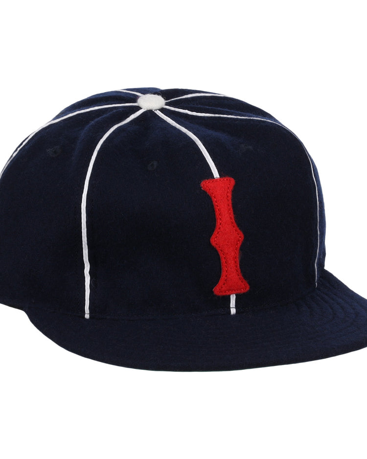 The EFF Indianapolis Indians 1935 Vintage Ballcap is a navy blue cap with white seam piping and a red vertical I patch, inspired by the original classic design.