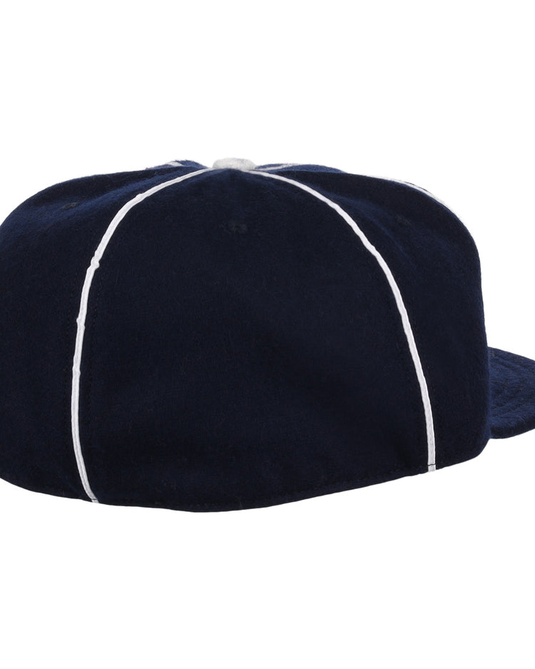 The EFF Indianapolis Indians 1935 Vintage Ballcap is navy blue with white vertical piping, a small top button, and shown from the back.