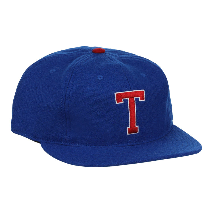 The EFF Tacoma Cubs 1969 Vintage Ballcap features royal blue fabric, a red and white embroidered T, and a small red top button, inspired by the classic Tacoma Cubs design.