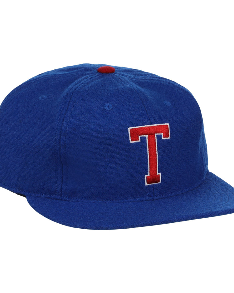 The EFF Tacoma Cubs 1969 Vintage Ballcap features royal blue fabric, a red and white embroidered T, and a small red top button, inspired by the classic Tacoma Cubs design.