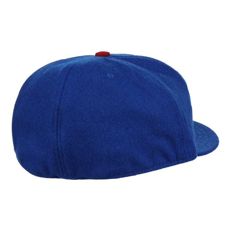 The EFF Tacoma Cubs 1969 Vintage Ballcap is a blue hat with a red button, seen from the back and side, featuring no visible logos—evoking the classic Pacific Coast League style.