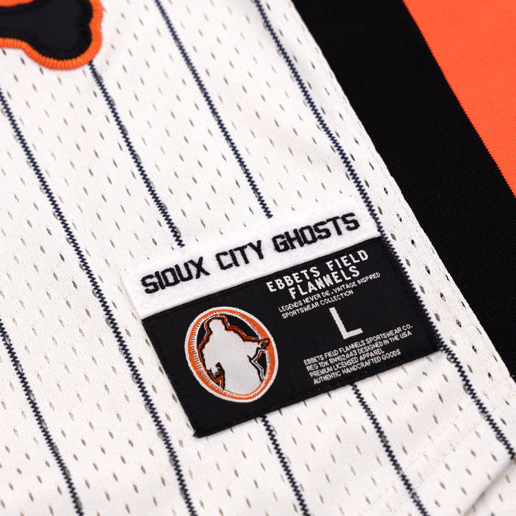 A close-up of the Sioux City Ghosts EFF Pinstripe Button Down Jersey by EFF, featuring a white pinstripe design and a black-and-orange patch with a ghost silhouette.