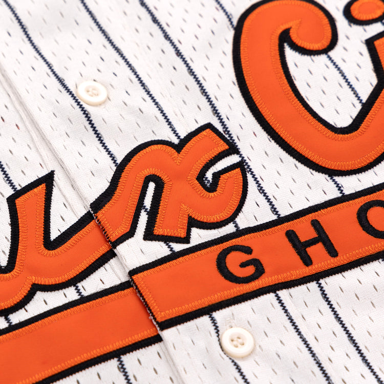 Close-up of the EFF Sioux City Ghosts EFF Pinstripe Button Down Jersey, featuring white pinstripes, orange and black embroidered GH lettering inspired by the Sioux City Ghosts, white buttons, and stitched details.