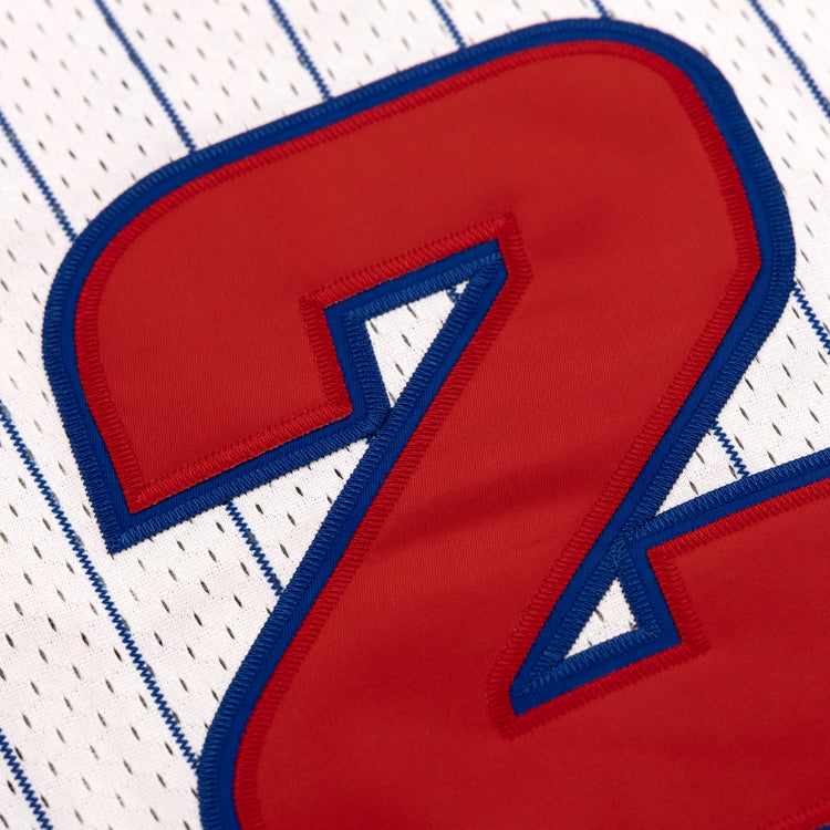 Close-up of a large red number 2 outlined in blue on a Sankei Atoms EFF Pinstripe Button Down Jersey by EFF, featuring thin blue vertical stripes on white.