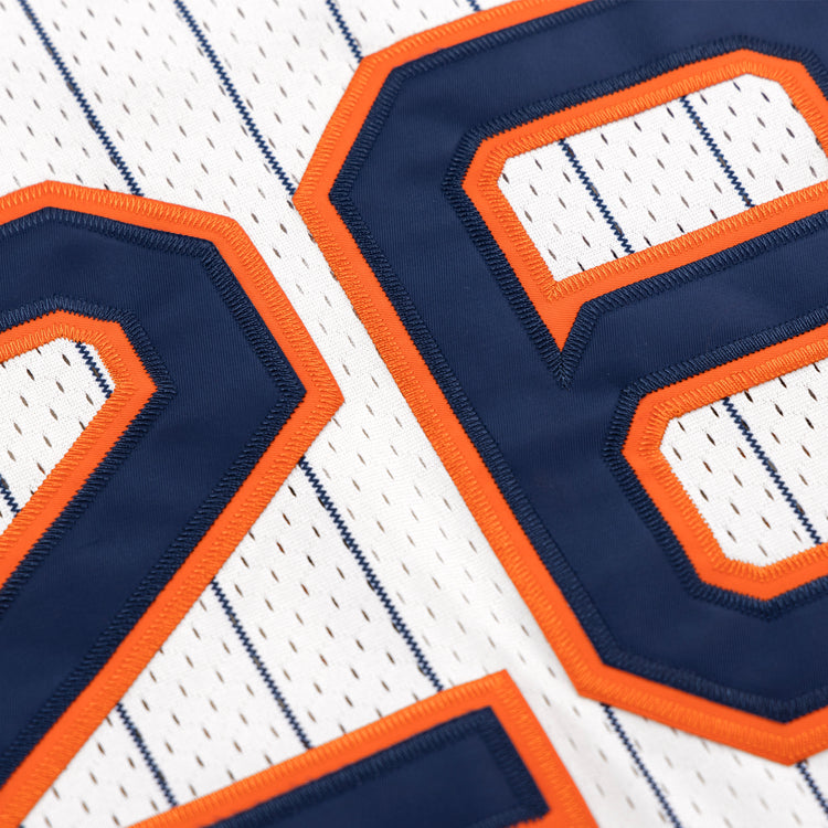 Close-up of the San Francisco Seals EFF Pinstripe Button Down Jersey by EFF, featuring thin blue pinstripes and large blue numbers outlined in orange stitching.