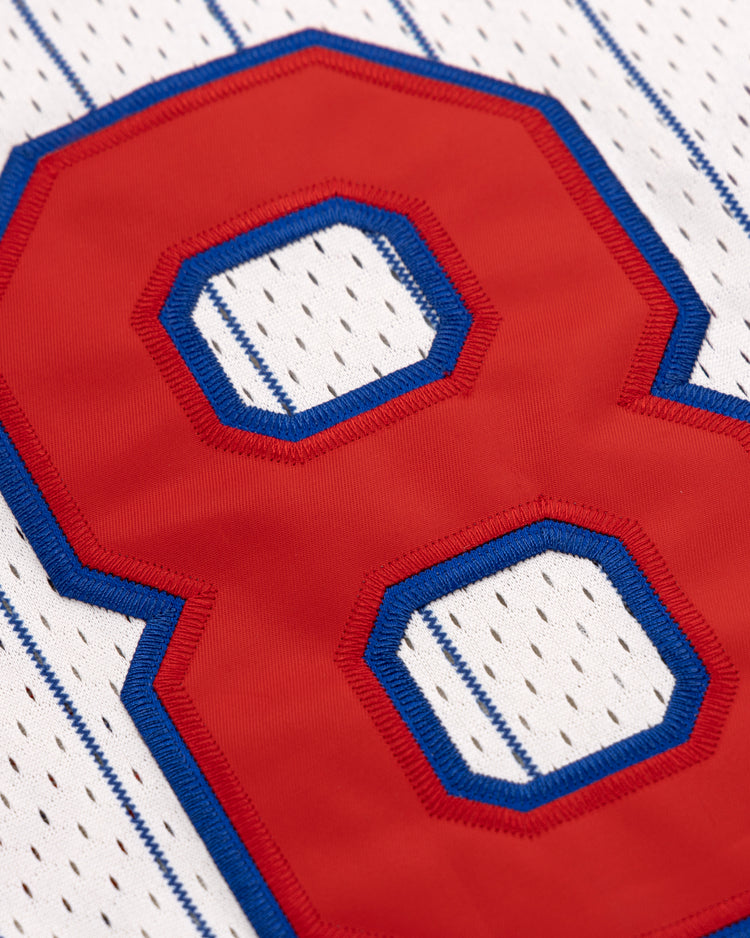 The EFF Reddy Kilowatt Pinstripe Button Down Jersey features a large red number 8 with blue trim, stitched onto white fabric with classic vertical blue pinstripes for a vintage baseball look.