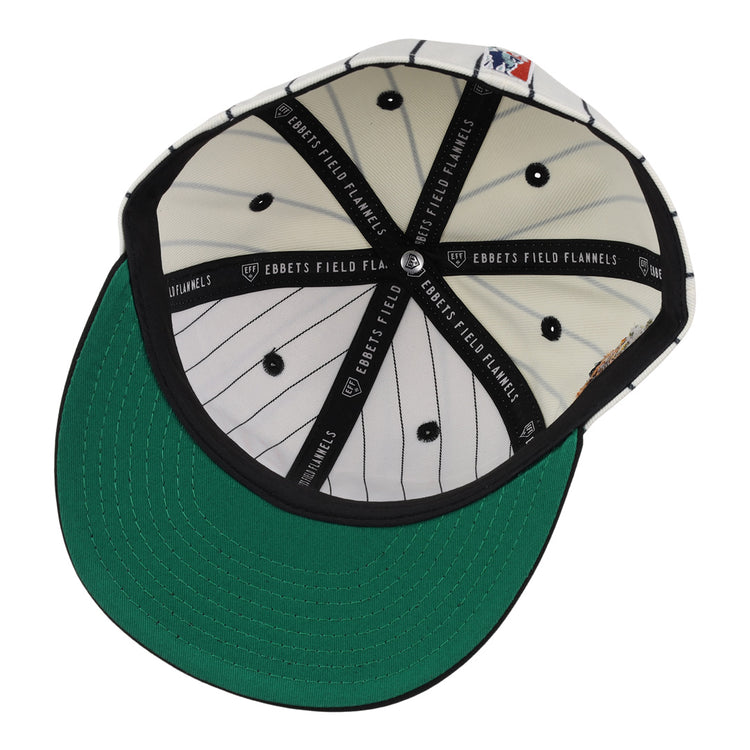 The underside of the Veracruz NLB Pinstripe Fitted Ballcap by EFF features a green brim, white inner panels with black pinstripes, black button details, and black bands labeled EBBETS FIELD FLANNELS.