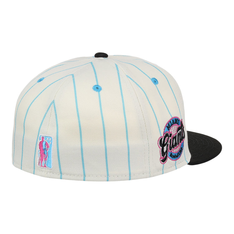 The EFF Miami Giants NLB Pinstripe Fitted Ballcap features a white design with light blue pinstripes, black brim, round embroidered Miami Giants logo, and side baseball player patch.