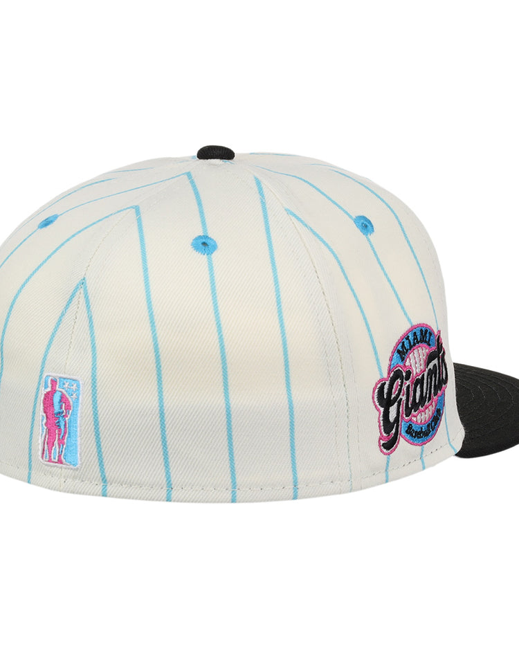 The EFF Miami Giants NLB Pinstripe Fitted Ballcap features a white design with light blue pinstripes, black brim, round embroidered Miami Giants logo, and side baseball player patch.
