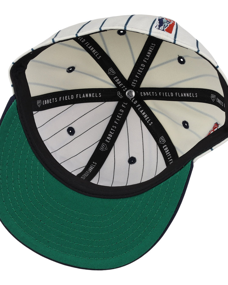 The underside of the EFF Detroit Stars NLB Pinstripe Fitted Ballcap features a green brim, black interior taping with EBBETS FIELD FLANNELS text, white pinstriped fabric, and a red, white, and blue patch.
