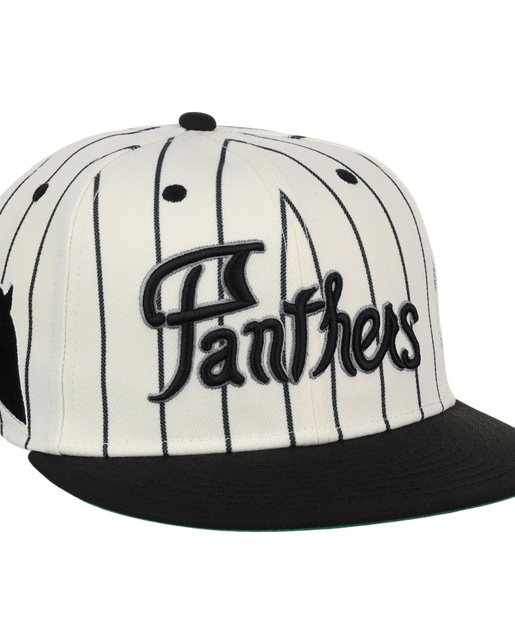 The EFF Montreal Black Panthers NLB Pinstripe Fitted Ballcap features a white base with black pinstripes, black bill, bold Panthers embroidery, and a small black panther graphic on the side.