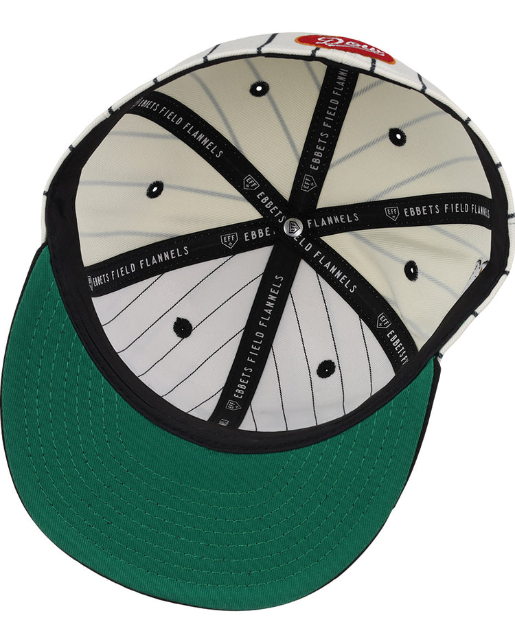 The Montreal Black Panthers NLB Pinstripe Fitted Ballcap by EFF features a green brim, white and black pinstriped lining, Ebbets Field Flannels bands, a red tag, and black ventilation holes.