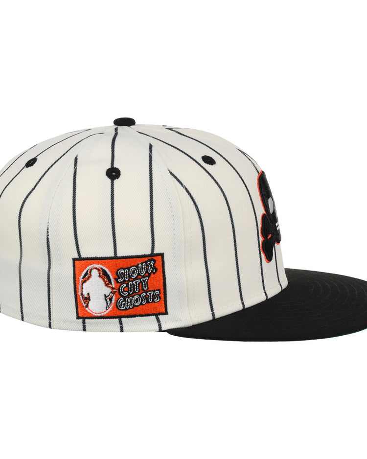The EFF Sioux City Ghosts Pinstripe Fitted Ballcap features a white pinstripe design, black brim, and a side patch with an orange background, ghost graphic, and “Shout Out Ghosts” text—a tribute to the team.