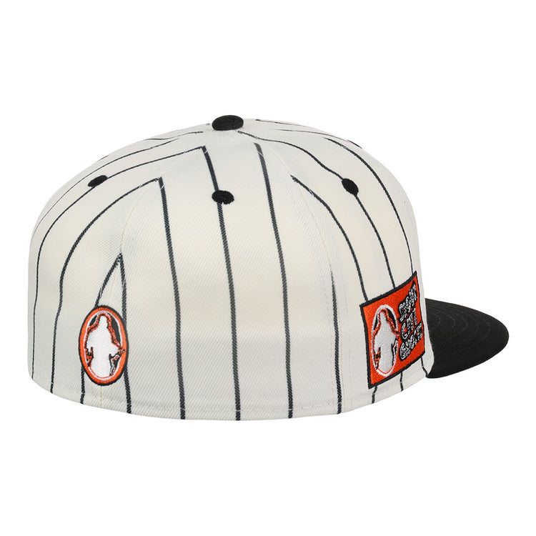 The Sioux City Ghosts EFF Pinstripe Fitted Ballcap by EFF is a white cap with black pinstripes, black brim and button, plus two bold orange and white Sioux City Ghosts patches on the side.