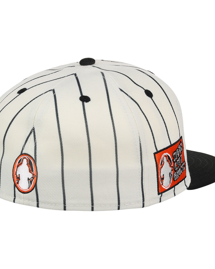 The Sioux City Ghosts EFF Pinstripe Fitted Ballcap by EFF is a white cap with black pinstripes, black brim and button, plus two bold orange and white Sioux City Ghosts patches on the side.