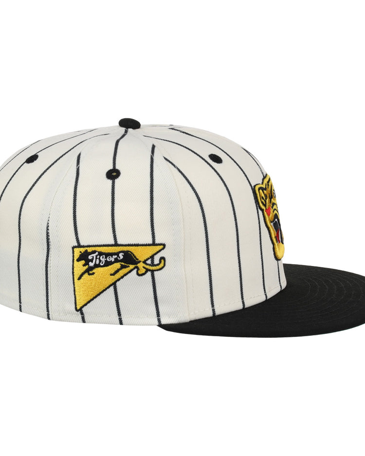 The Osaka Tigers EFF Pinstripe Fitted Ballcap by EFF is a white hat with black pinstripes, a black brim, a yellow Tigers pennant patch on the side, and a tiger face logo on the front.