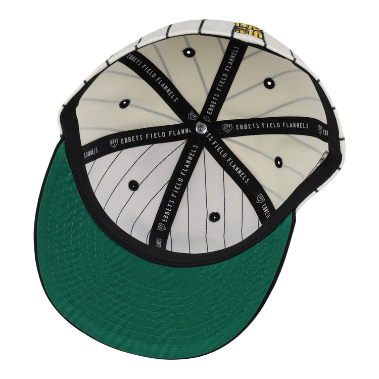 The Osaka Tigers EFF Pinstripe Fitted Ballcap by EFF features black and white pinstripe fabric inside, a green under-brim, black taping with EBBETS FIELD FLANNELS text, and a yellow logo patch honoring Black baseball history.