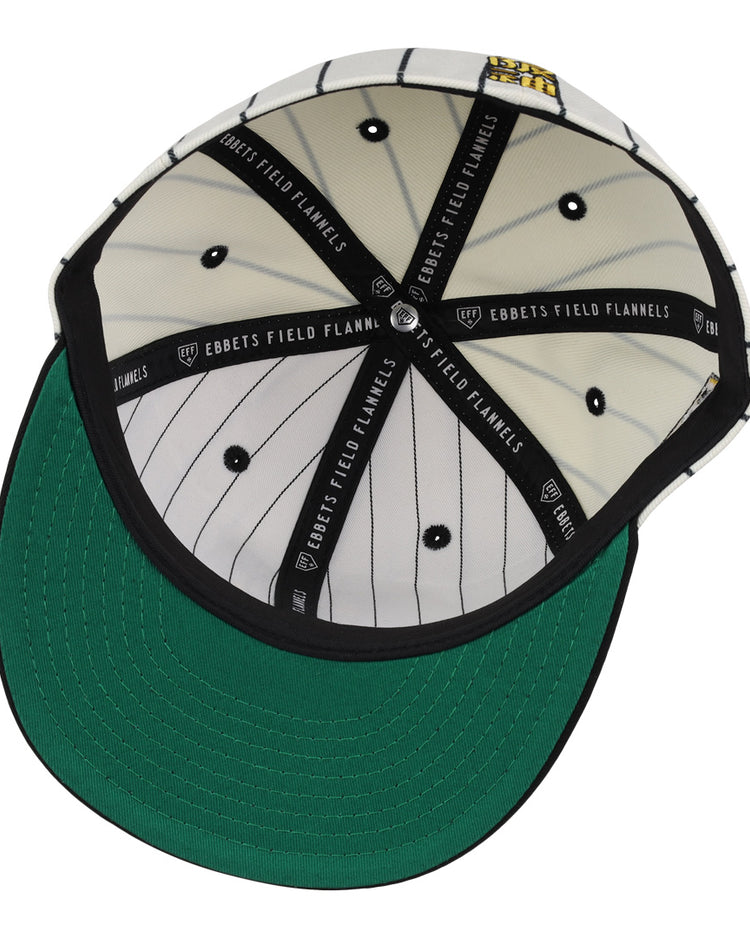 The Osaka Tigers EFF Pinstripe Fitted Ballcap by EFF features black and white pinstripe fabric inside, a green under-brim, black taping with EBBETS FIELD FLANNELS text, and a yellow logo patch honoring Black baseball history.