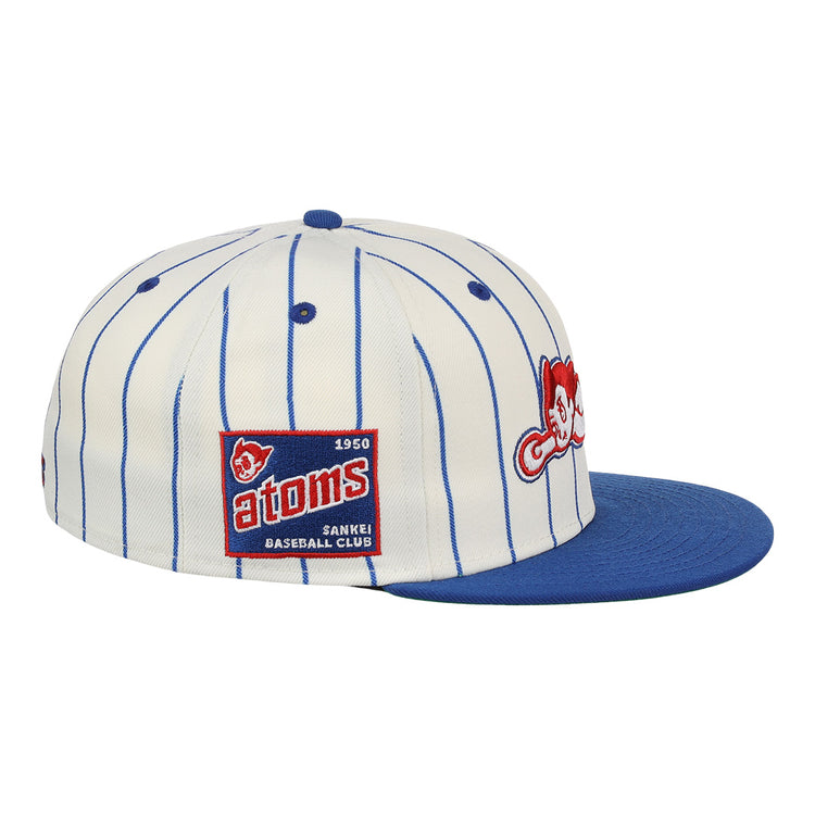 The Sankei Atoms EFF Pinstripe Fitted Ballcap by EFF features blue pinstripes, a blue brim, a atoms 1950 SANKEI BASEBALL CLUB patch, and an embroidered red Atom Boy mascot on the front.