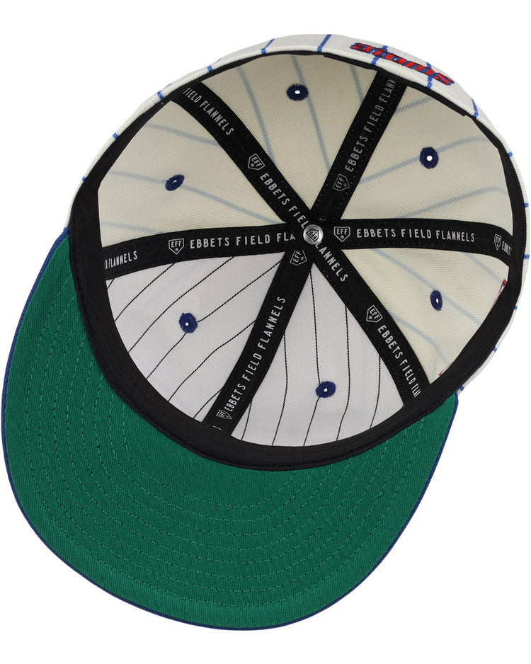 The underside of the Sankei Atoms EFF Pinstripe Fitted Ballcap by EFF features a green brim, white pinstriped inner lining with blue dots, a black band, and repeated EBBETS FIELD FLANNELS print inside.