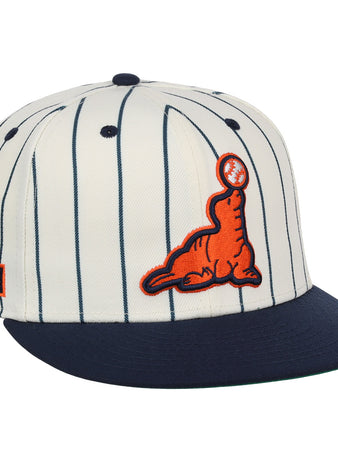 The EFF San Francisco Seals Pinstripe Fitted Ballcap features a white body with navy pinstripes, a navy brim, an orange embroidered seal with a black baseball on its nose, and an orange/navy Seals patch on the side.