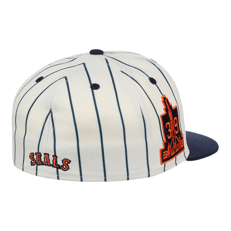 The EFF San Francisco Seals Pinstripe Fitted Ballcap features a white base with navy pinstripes, a navy brim, orange SEALS text on the back, and a large orange 319 cityscape patch—celebrating the iconic team.