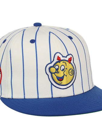 The EFF Reddy Kilowatt EFF Pinstripe Fitted Ballcap features a white base with blue pinstripes, a blue brim, and playful patches, including a smiling yellow Reddy Kilowatt face with red horns and a circular patch on the side.