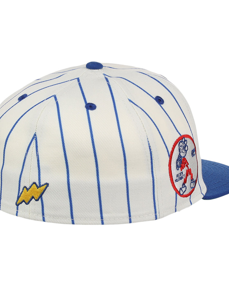 The Reddy Kilowatt EFF Pinstripe Fitted Ballcap by EFF features blue vertical pinstripes on white, a blue brim, a yellow Reddy Kilowatt lightning bolt patch on the side, and a circular Bear Bottom bear patch on the back.