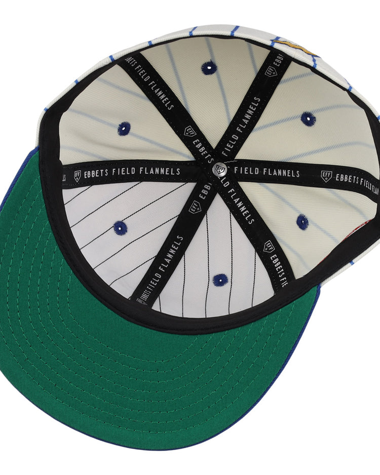 The image shows the inside of the EFF Reddy Kilowatt Pinstripe Fitted Ballcap. It features a green underbrim, white crown with blue pinstripes, black EBBETS FIELD FLANNELS taping, and visible blue rivets.
