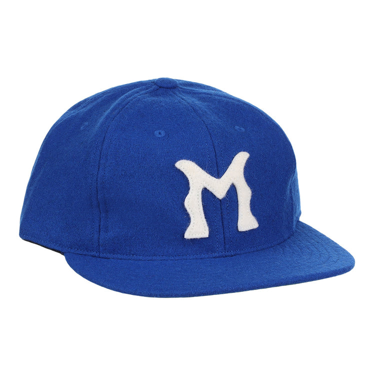 The EFF Montreal Royals 1954 Vintage Ballcap is a blue wool cap with a white, stylized M—replicating the iconic look worn by legends like Roberto Clemente.