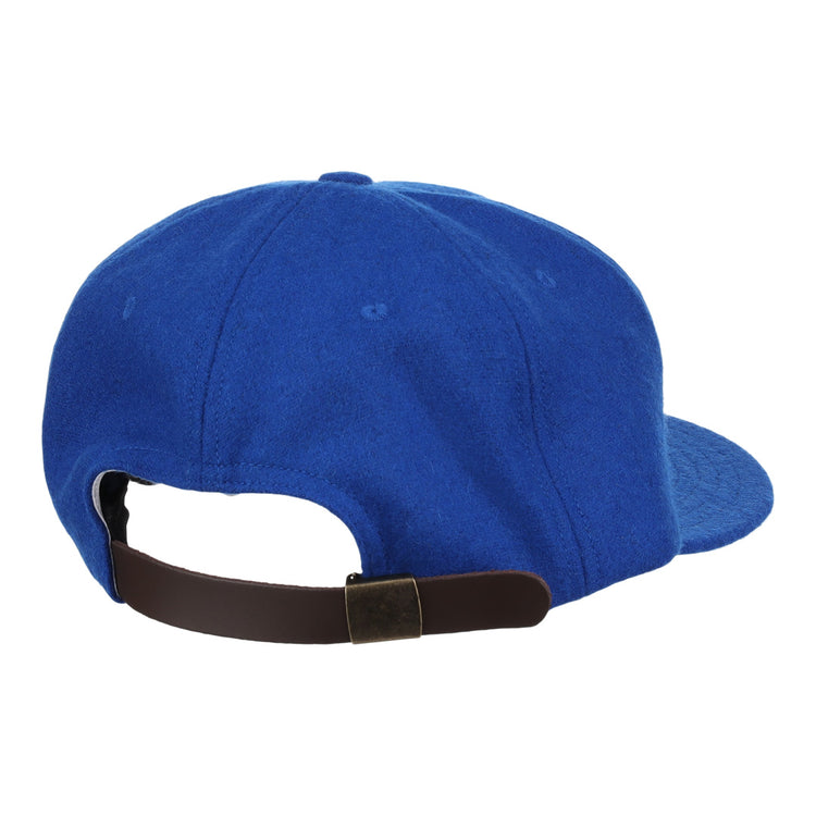 The EFF Montreal Royals 1954 Vintage Ballcap is a blue cap shown from the back, inspired by the original, and features a dark brown adjustable strap with a brass buckle.